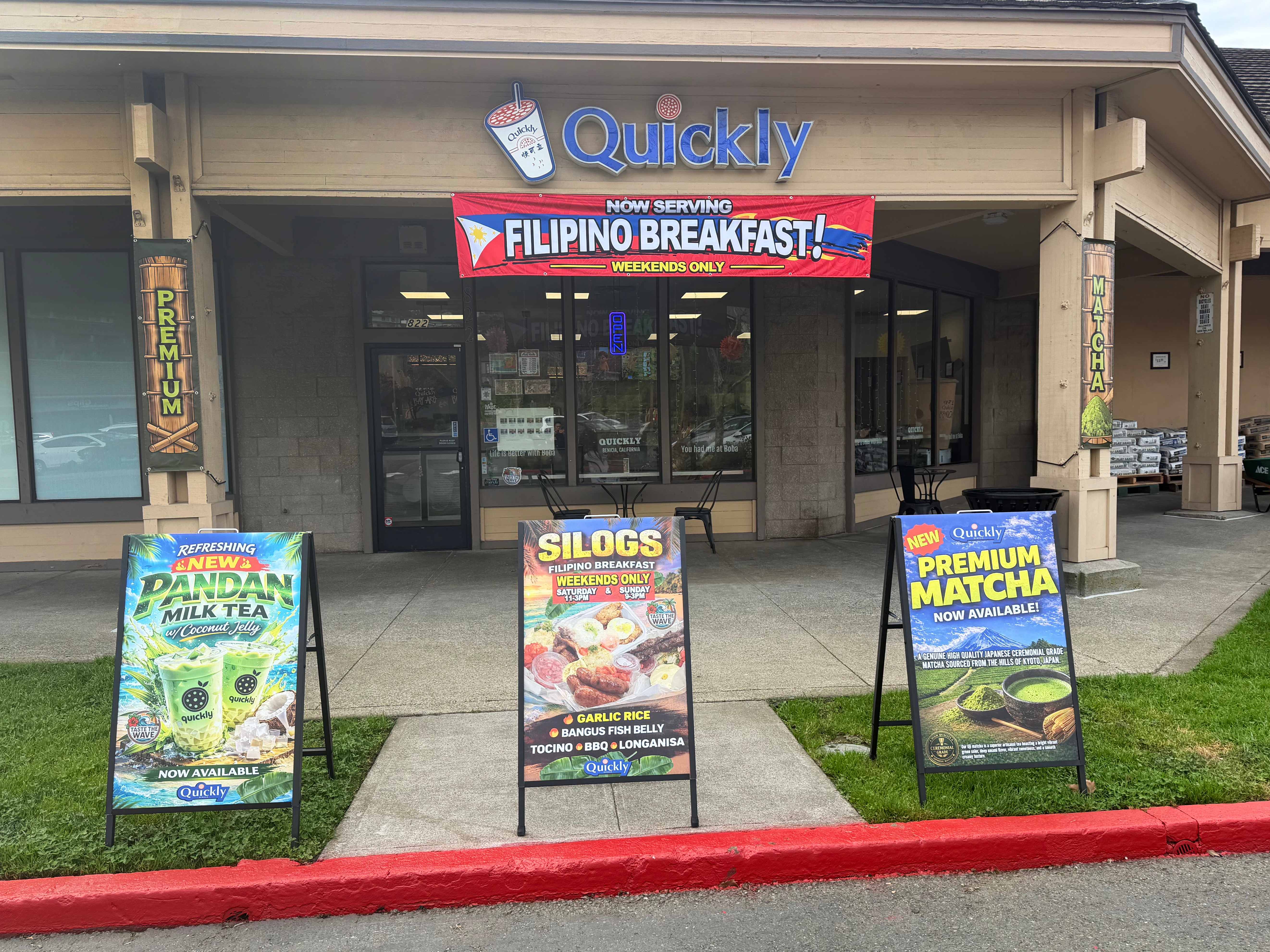 Quickly Benicia storefront showing Filipino Breakfast banner, Silogs menu board, Pandan Milk Tea sign, and Premium Matcha sign